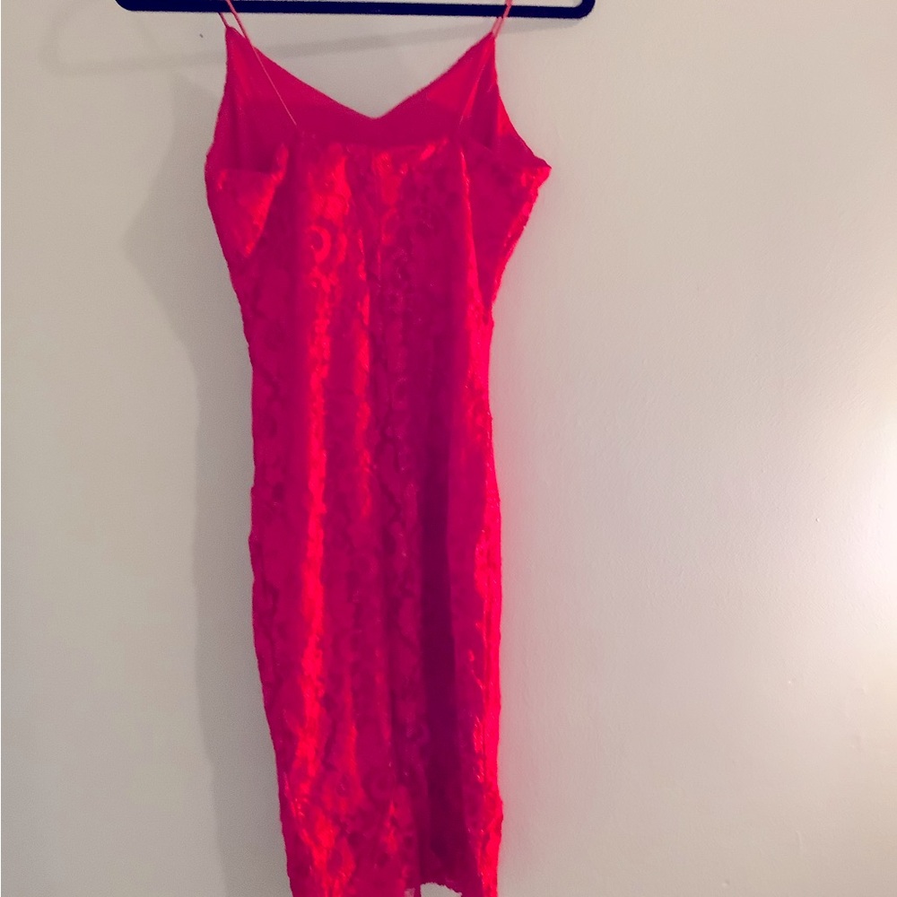 Red dress made by brand most famous 
Size medium 
Red
Lace 
Stretchy fabric